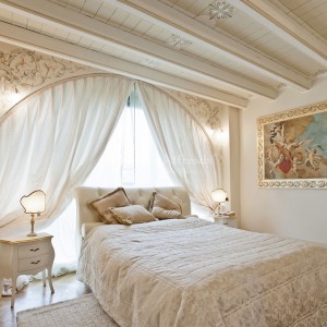 Bedroom decorated with classic fresco fixed on a frame, wall and ceiling decorations